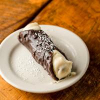 Chocolate Cannoli · Crispy pastry shell hand dipped in dark chocolate,
filled with fresh ricotta.