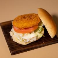 Vegetable Korokke Burger · Vegetable croquette with lettuce, tomato, Japanese mayo on a potato bun.