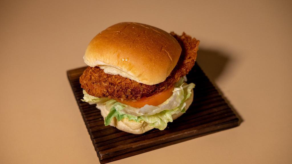 Chicken Cutlet Burger · Fried chicken cutlet with lettuce, tomato, tonkatsu sauce, Japanese mayo on a potato bun.