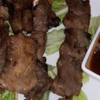 Grilled Pork · Grilled marinated pork with Thai spices and served with Thai spicy sauce.