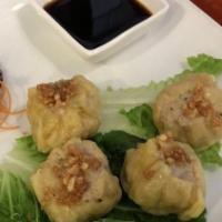 Steamed Thai Dumpling · Stuffed with chicken, shrimp, water chestnut, and mushroom. Served with homemade soy sauce.