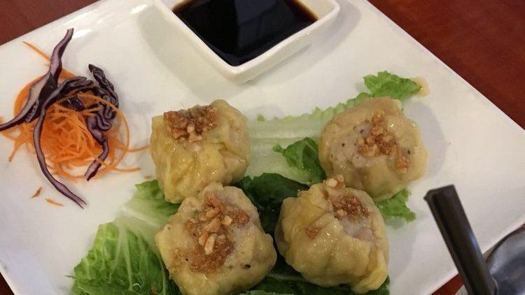 Steamed Thai Dumpling · Stuffed with chicken, shrimp, water chestnut, and mushroom. Served with homemade soy sauce.