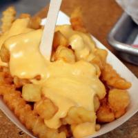 Cheese Fries · Fries smothered w/ nacho cheese sauce