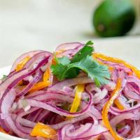 Creole Salad · Sliced red onion, sliced tomato, cilantro, lemon, salt, pepper and olive oil.