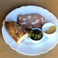 Country Pate · House made with Berkshire pork & organic chicken; served with cornichons, mustard, baguette.