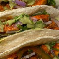 Chicken Tikka Taco · Chicken Tikka, red onion, lettuce, peppers in a soft corn taco with Chef's special sauce