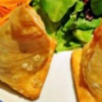 Vegetable Samosa · Pastry turnovers stuffed with spiced potatoes and green peas.