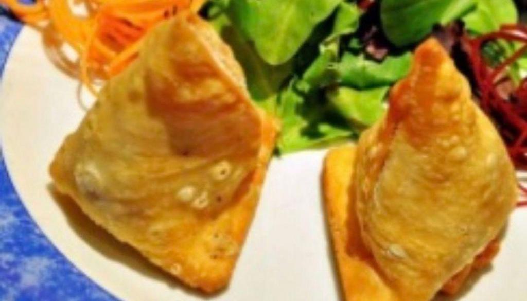 Vegetable Samosa · Pastry turnovers stuffed with spiced potatoes and green peas.