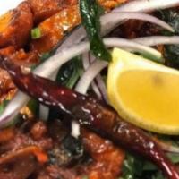 Chicken 65 · Chicken breast marinated in South Indian spices and tossed with curry leaves, garlic and gin...