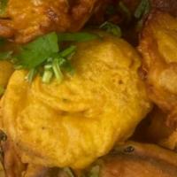 Vege. Bhajias · An assortment vegetable fritters, (eggplant, potato, cauliflower, onions).