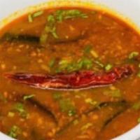 Nimma Rasam · South Indian hot and sour soup made of tomato, tamarind, herbs, and spices.