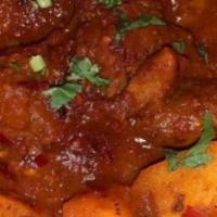 Lamb Vindalo · Lamb cooked in a spicy and tangy curry sauce - Goa