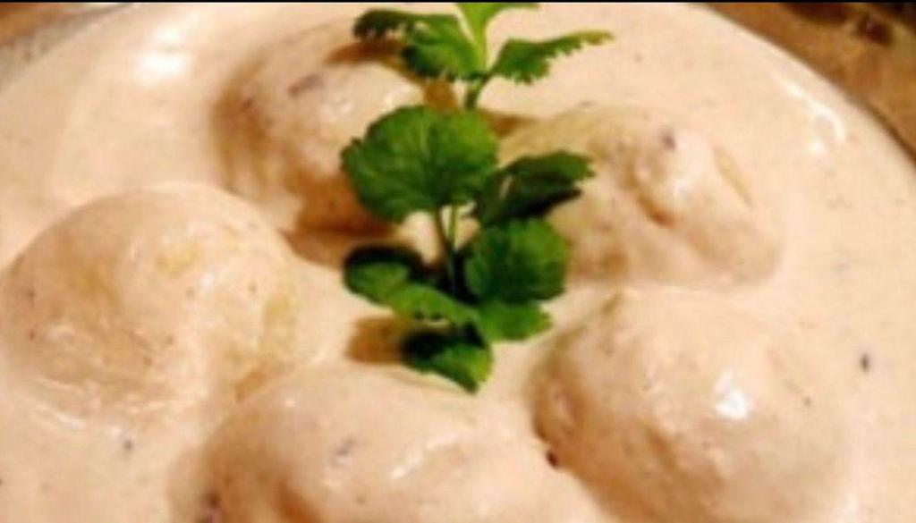 Malai Kofta · Vegetable and cheese dumplings in a mild cashew and almond sauce.