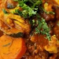 Vege.Vindaloo · Mix vegetables cooked in spicy and tangy tomato curry sauce.