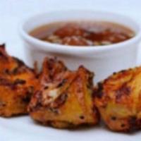 Chicken Tikka · Chunks of chicken breast marinated with yogurt, herbs, and spices.