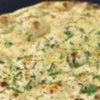 Garlic Naan · Naan seasoned with minced garlic and cilantro.