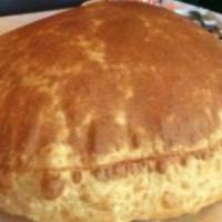Poori · A puffed unleavened whole wheat bread.