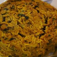 Goat Biriyani · Saffron basmati rice cooked in a goat stew with nuts , raisins and spices.