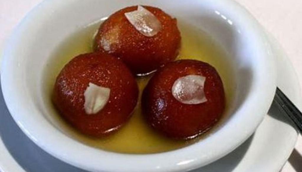 Gulab  Jamun -To Go · Dry milk balls soaked in cardamom flavored honey sugar syrup.