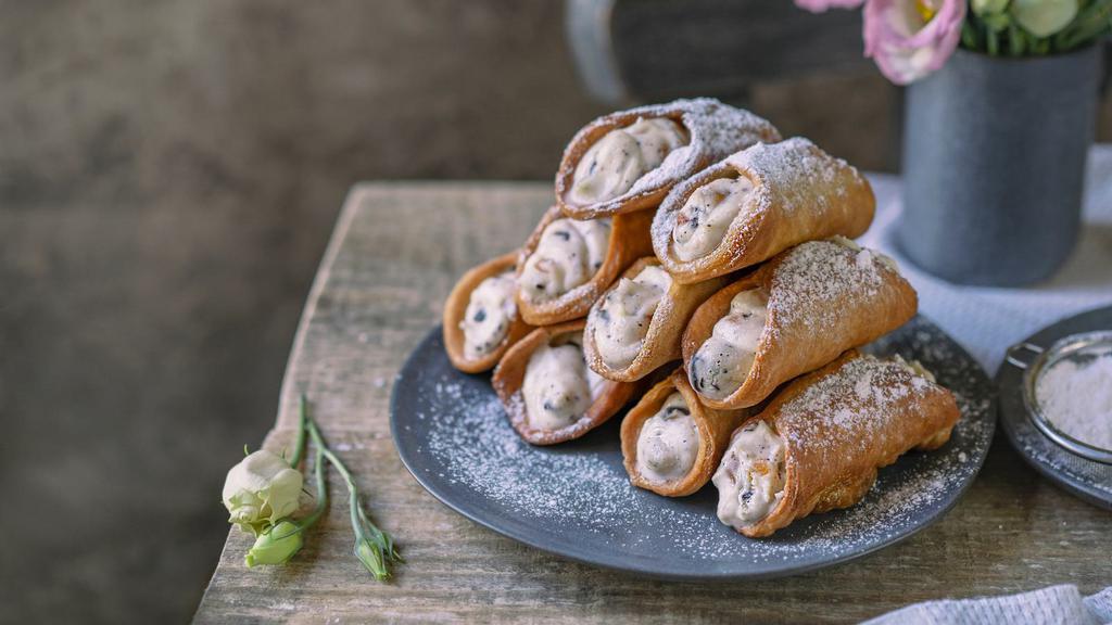 Cannoli · Classic Italian pastry filled with sweet ricotta cheese.
