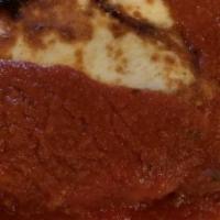 Chicken Parmigiana · Chicken cutlet lightly breaded and baked with mozzarella cheese in a tomato sauce.