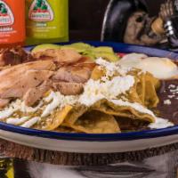 Chilaquiles (New) · Corn Tortillas Mixed With Homemade Sauce With Peppers, Onions & Spices ·Topped With Fried Eg...