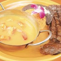 Mar Y Tierra (New) · A Delicious Combo Of A 12 Oz. Prime Skirt Steak Cooked To Order With Shrimp In Garlic Sauce....