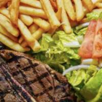 T-Bone Steak (New) · A Fine 12 Oz. T·Bone Steak Cooked To Order & Served With Salad & Fries.