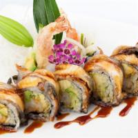 Dragon · Soft shell crab, cream cheese, cucumber topped with eel & avocado and eel sauce.