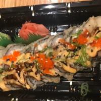 Godzilla Maki S · Six pieces. Cooked. Tempura style roll with salmon, white tuna, avocado, topped with eel sau...