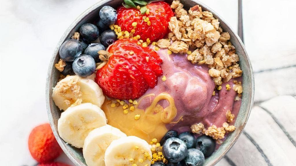 Almond Butter Coconut Bowl · Base: Blended with pure coconut, banana, coconut milk. Topped with granola, banana, strawberry, coconut flakes, Almond butter.