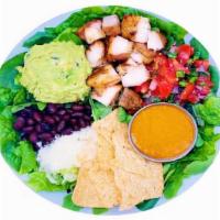 Family Meal - Chipotle Chicken  (Serves 4-5 People) · Pick 3 bases, marinated chicken thigh, guacamole, salsa black beans, tortilla chips, and goa...