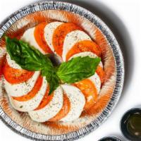 Insalata Caprese · Fresh mozzarella, sliced tomatoes, basil, olive oil, balsamic vinegar.