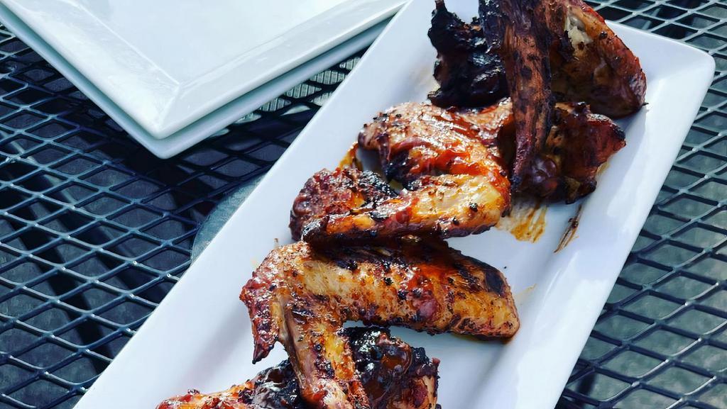 Grilled Wings Lunch · dry-rubbed wings, buttermilk bleu cheese, choice of house made sauce: scotch bonnet pepper sauce, or chipotle BBQ