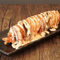 Grilled Tse Roll · Spicy tuna, shrimp tempura topped with grilled tuna, salmon, eel and special sauce.