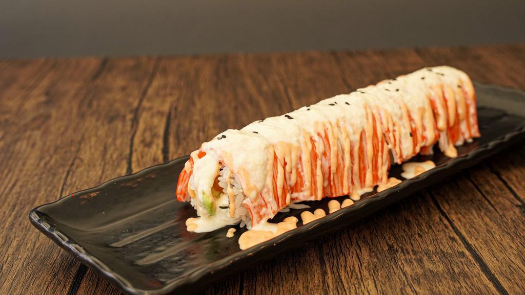 Snowy Roll · Salmon, cream cheese, avocado topped with crab meats, spicy mayo and pineapple mango sauce