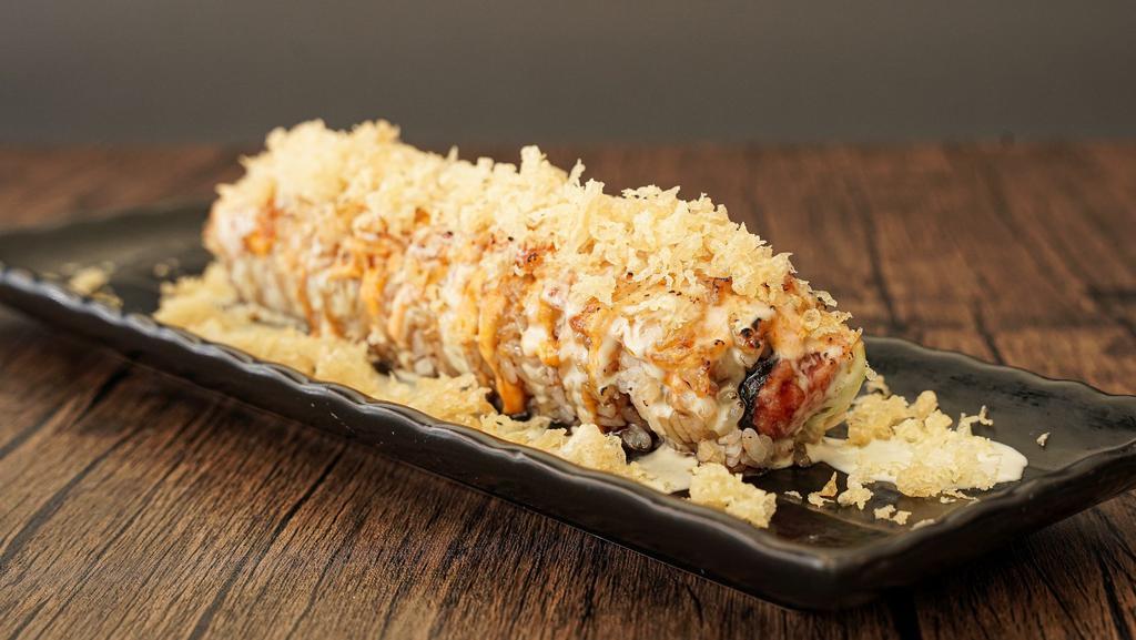 Venus Roll · Spicy tuna and avocado topped with cooked shrimp, spicy mayo, special sauce torched with fire and crunch on the top