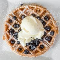 Vanilla Berry Waffles · Belgium waffle topped with vanilla ice cream and fresh blueberries.