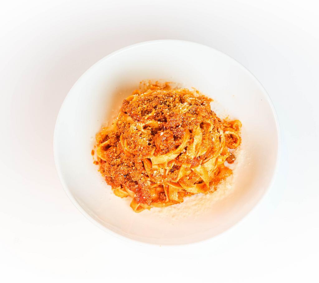 Tagliatelle Alla Bolognese · Thin, Ribbon-shaped Housemade Pasta, Beef & Pork Ragù, Mutti Tomato, Parimiagno Reggiano DOP
