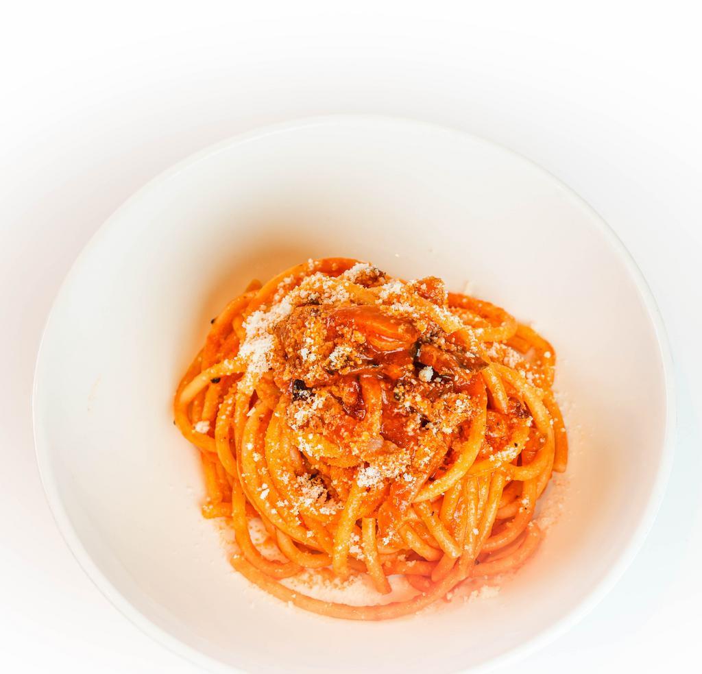 Bucatini All'Amatriciana · Afeltra bucatini, tempesta guanciale, red onion, mutti tomato sauce, chili, pecorino romano zerto.