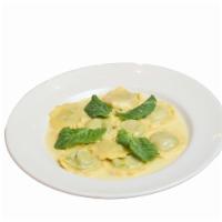 Ravioli Di Piselli · Housemade Ravioli Filled with Spring Pea and Calabro Ricotta, Butter, Pea Shoots