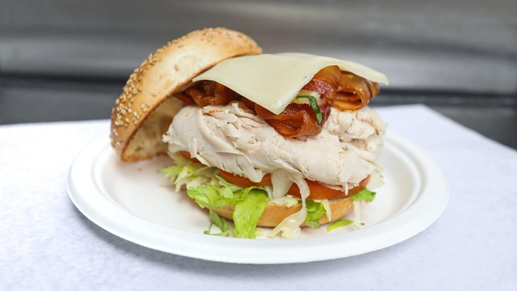 Turkey Club Sandwich Cold Special · With Swiss cheese, bacon, lettuce, tomato and mayo. Served with chips and pickle on a round roll, long roll or your choice of bread whole wheat, white or rye.