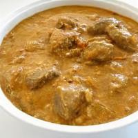Lamb Korma · Gluten free. Boneless lamb cooked in rich sauce with cashews, almond, and touch of cream.