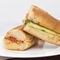Baked Tofu (Korean Bulgogi Flavored) Banh Mi Sandwich · Korean Bulgogi flavored Tofu on a hot toasted French Baguette with a spread of hummus, roast...