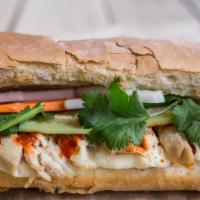Chicken Banh Mi Sandwich (Combo) · Roasted chicken breast seasoned with our own blend on a hot toasted French baguette, light s...