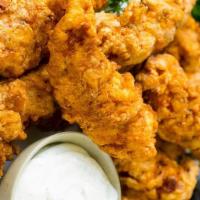 Chicken Fingers · Breaded or battered crispy chicken.