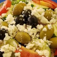 Greek Salad (Large) · Romaine lettuce, feta cheese, tomatoes, cucumbers, onions, green and black olives, oregano a...