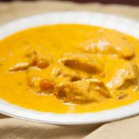 Chicken Shahi Korma · Tender pieces of chicken cooked in a nut and raisin sauce. Served with basmati rice.