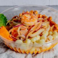 Ceviche Mix · Shrimp , fish , calamar , red onions sweet potatoes and leche de tigre.