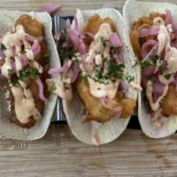 Fish Tacos · Beer battered cod, corn tortillas, coleslaw, pickled onions, chipotle sour cream